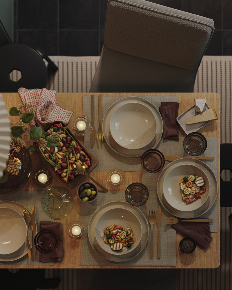 A TONSTAD extendable table is extended with the selfstoring leaf and has matching chairs and IBBARBO stools next to it.