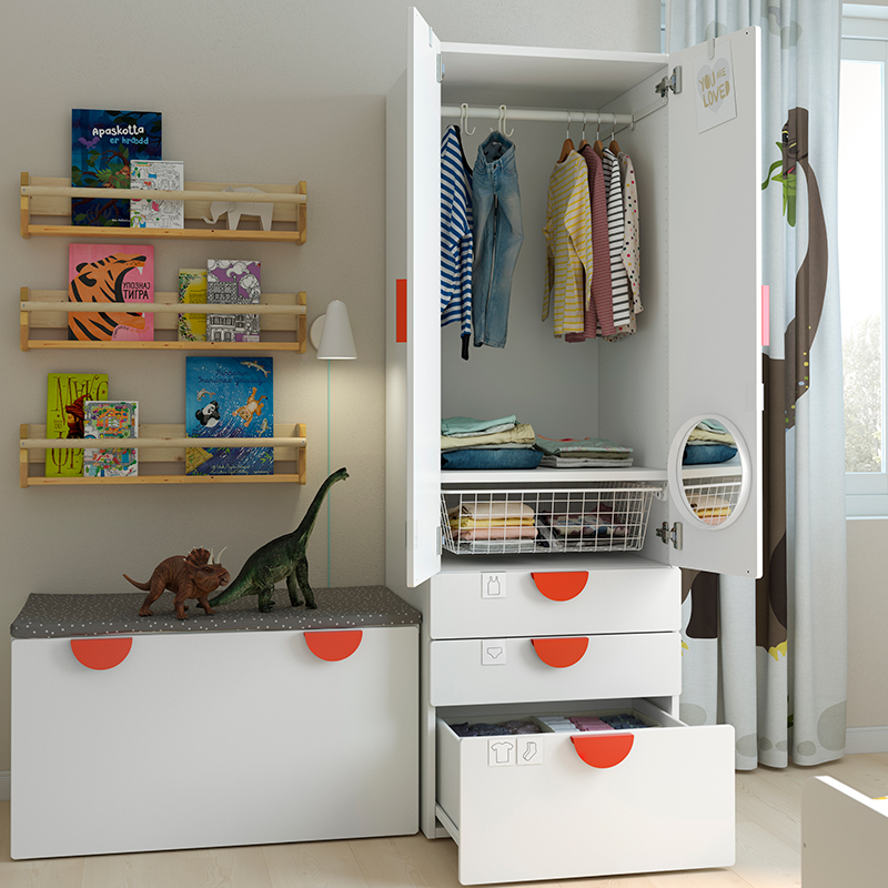 Modular wardrobe in a child's room with open doors and drawers