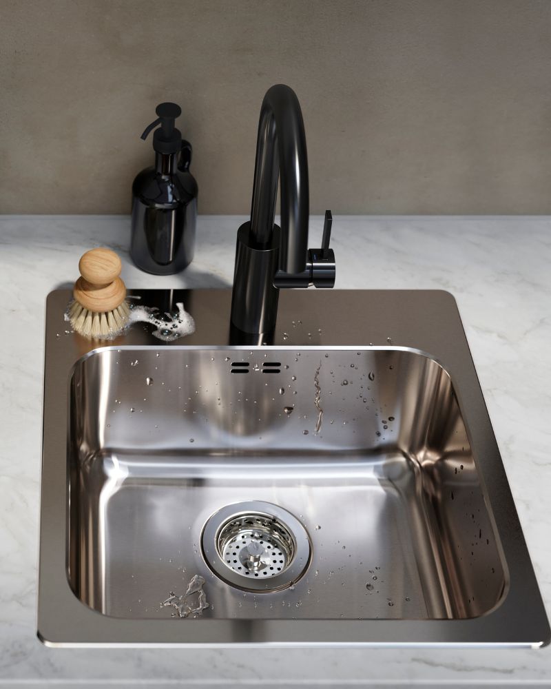 Modern sink area with IKEA SALLSJÖN pull-out faucet, LÅNGUDDEN inset sink, KASKER rail and VÄLVÅRDAD soap dispenser.