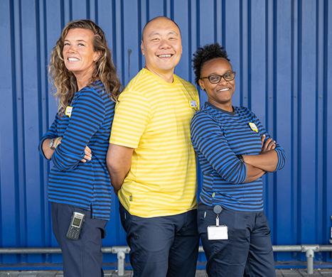 Three smiling IKEA employees