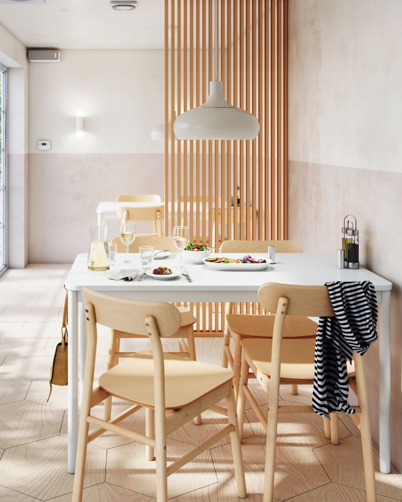 Modern dining area with TONSTAD table, RÖNNINGE chairs, NYMÅNE wall light, IKEA 365+ tableware and SVALKA wine glasses.