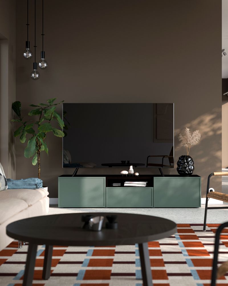 Modern living room with BESTÅ TV unit, STOCKHOLM 2025 coffee table, ULRIKSBERG armchair and STOCKHOLM 2025 vase.
