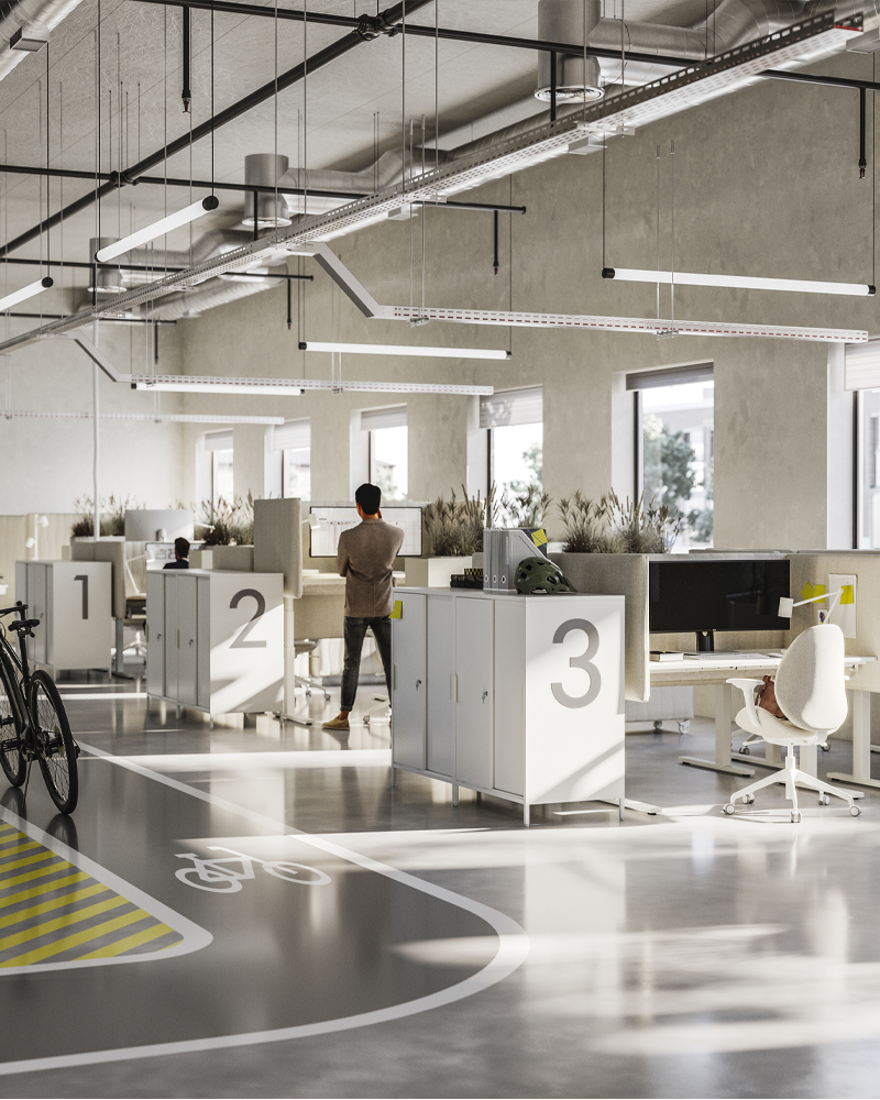 Three rows of desks in an airy, open-plan office. Each workstation features acoustic screens and ergonomic seating.