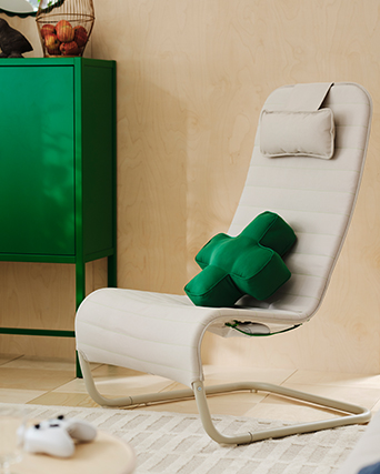 An YXSTABY gaming D-pad cushion is placed in a YXSTABY gaming lounge chair.