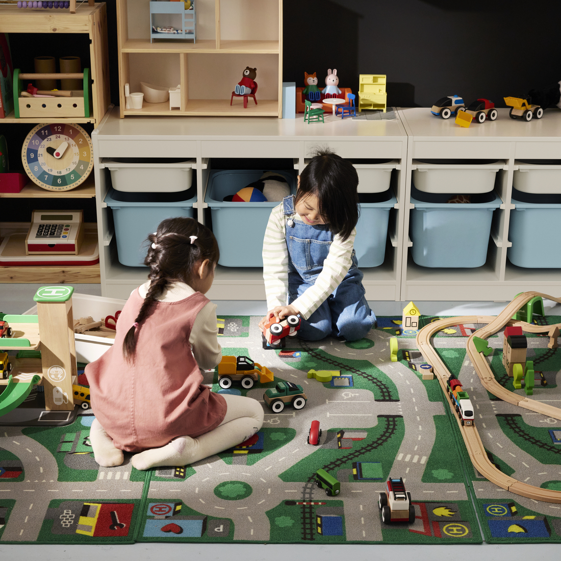 Children playing on an activity rug.