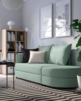 Light green sofa in a modern living room with natural light.